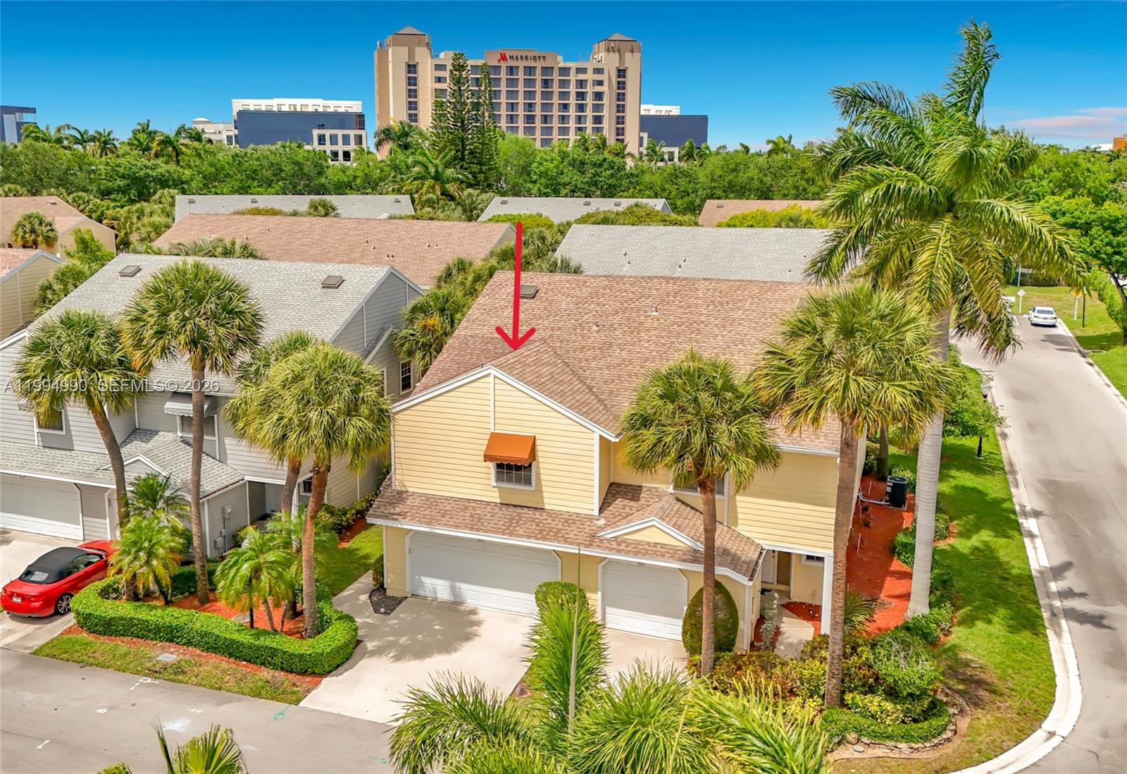An aerial view shows a yellow two-story house with a brown roof and palm trees — 5043 Pointe Emerald Ln, Boca Raton FL 33486, BOCA RATON, FL