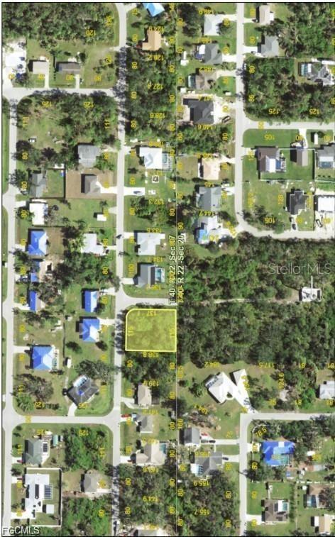 This is an aerial map showing a vacant residential lot highlighted in yellow — 1133 AMPLE AVENUE, PORT CHARLOTTE, FL
