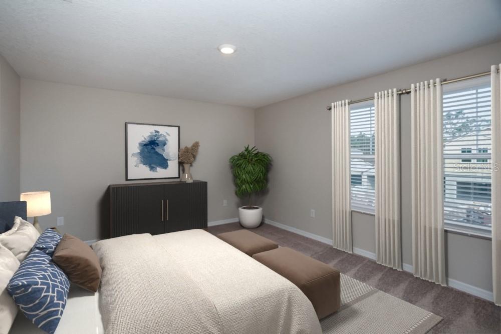 This bedroom features a bed, a dark cabinet, a potted plant, and windows with curtains — 5445 SAN PIETRO DRIVE, WINTER HAVEN, FL