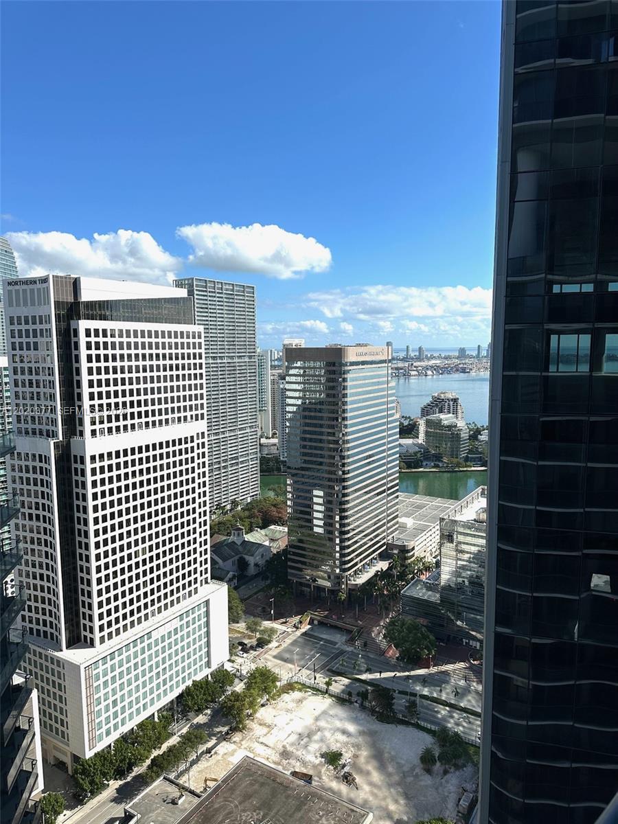 An elevated view of a city skyline featuring skyscrapers, a waterway, and a vacant lot — 801 S Miami Ave # 4305, Miami FL 33130, MIAMI, FL
