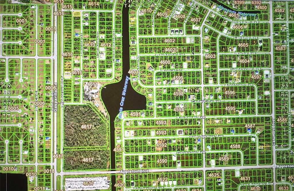 This is a map showing a residential neighborhood with streets, blocks, and a waterway — 10021 AMICOLA STREET, PORT CHARLOTTE, FL