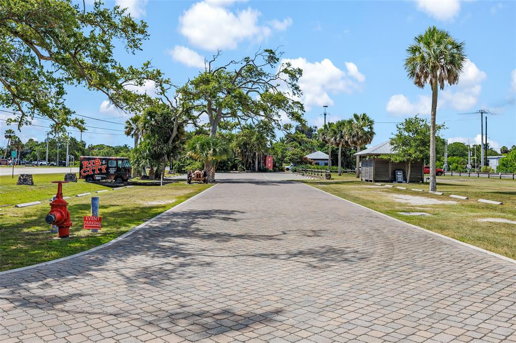 A paved driveway leads toward a Rib City food truck and a small wooden structure — 5390 US HIGHWAY 1, GRANT VALKARIA, FL