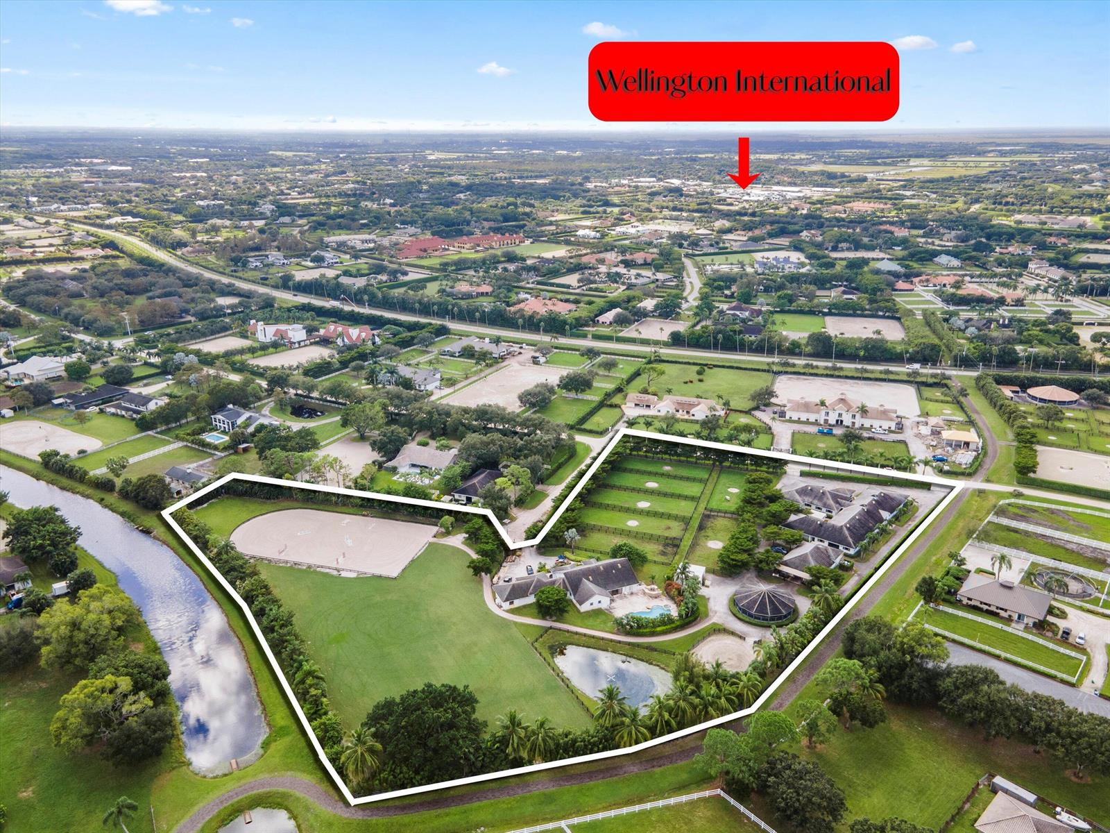 An aerial view shows a large equestrian estate with a house, stables, and riding arena — 2389 King Terrace, Wellington FL 33414, WELLINGTON, FL