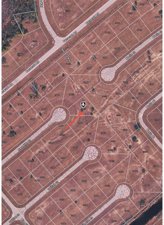 This is an aerial map showing a vacant residential lot marked with a red arrow — 14417 SWORDFISH COURT, PLACIDA, FL