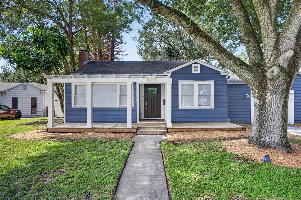 A blue house with a front porch, white trim, and a concrete walkway — 800 W SMITH STREET, ORLANDO, FL