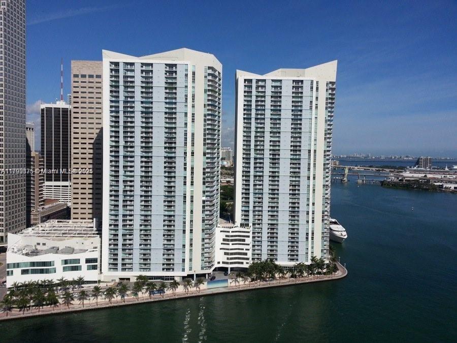 An aerial view of two tall residential towers situated along a waterfront in a city — 325 S Biscayne Blvd # 3822, Miami FL 33131, MIAMI, FL