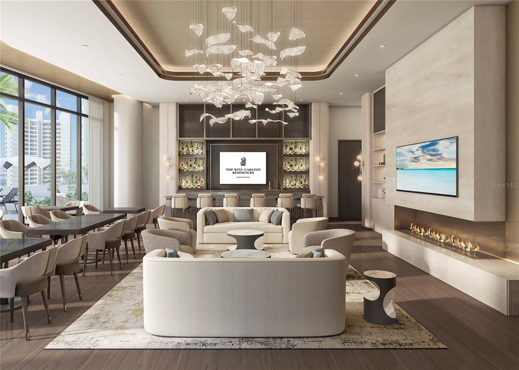 This rendering shows a modern lounge with a bar, fireplace, and large chandelier — 555 QUAY CMNS UNIT 1402, SARASOTA, FL