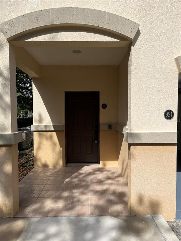A covered entryway with a brown door and the number 921 on the wall — 200 RIVERVIEW BEND UNIT 921, PALM COAST, FL