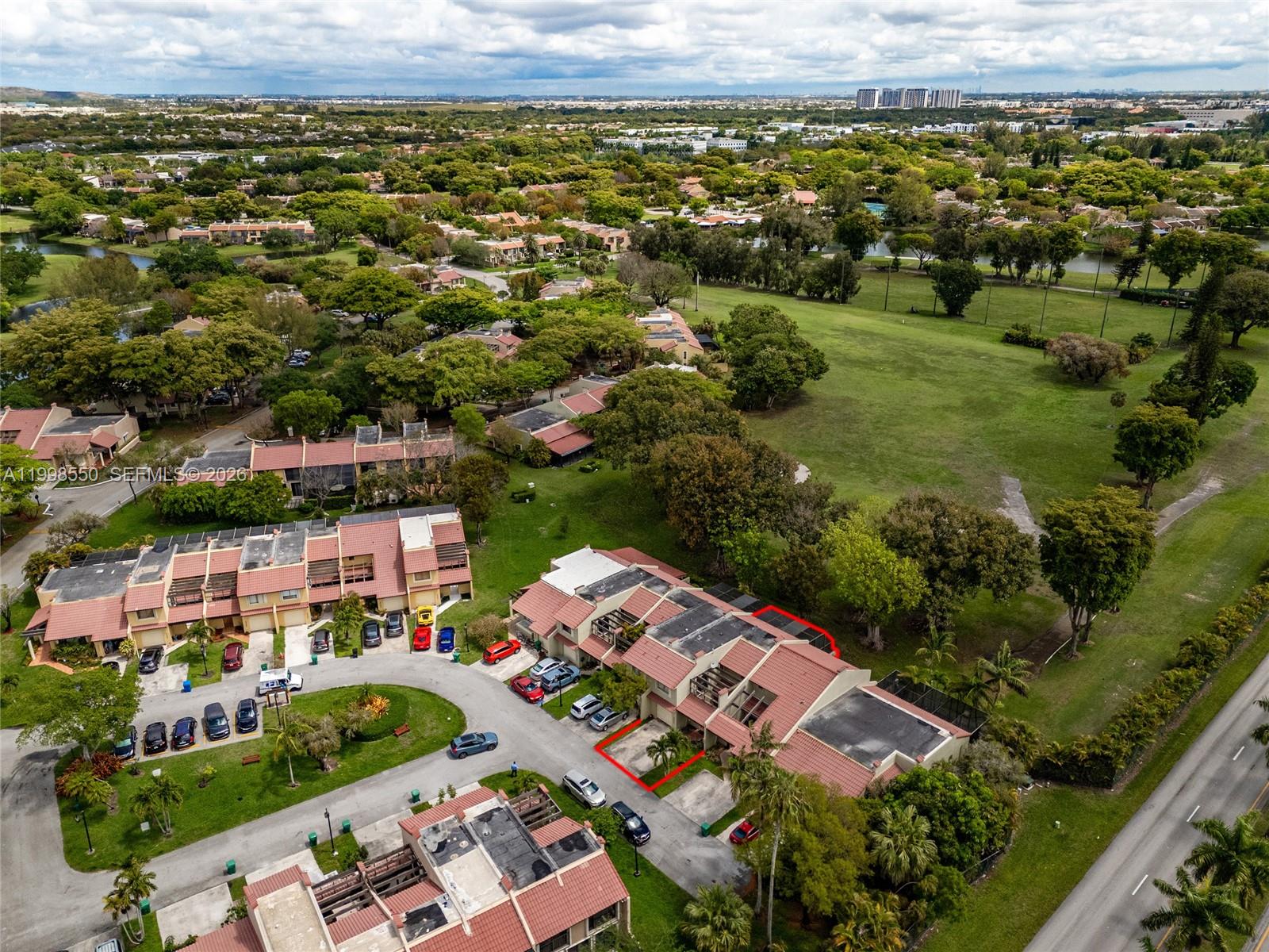 An aerial view shows a residential townhouse complex with a red-outlined unit and parking area — 3325 Torremolinos Ave # 44, Doral FL 33178, DORAL, FL