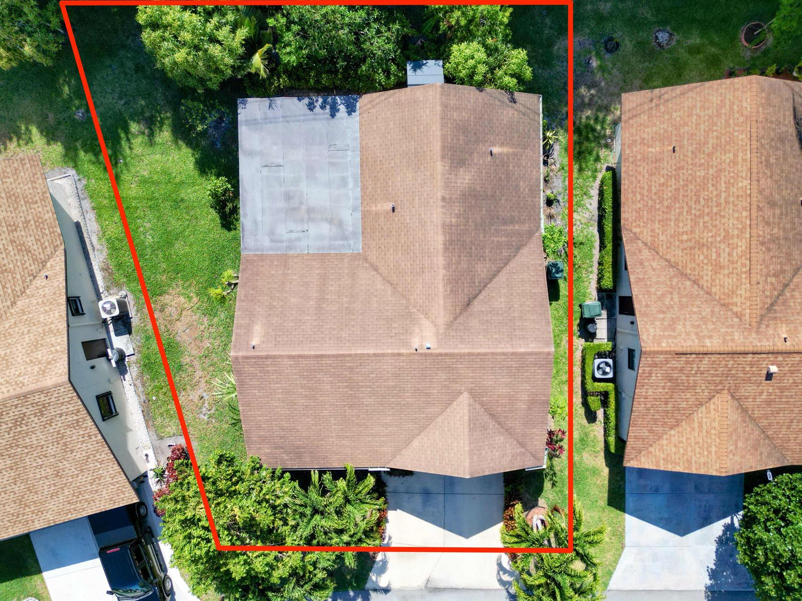 An aerial view shows a house with a brown shingled roof and a flat section — 6345 Tall Cypress Circle, FL 33463, FL