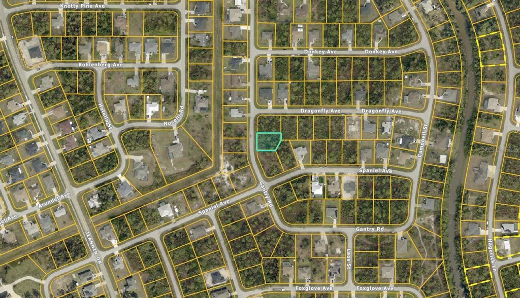 This is an aerial map showing a vacant residential lot highlighted in a suburban neighborhood — GANTRY ROAD, NORTH PORT, FL