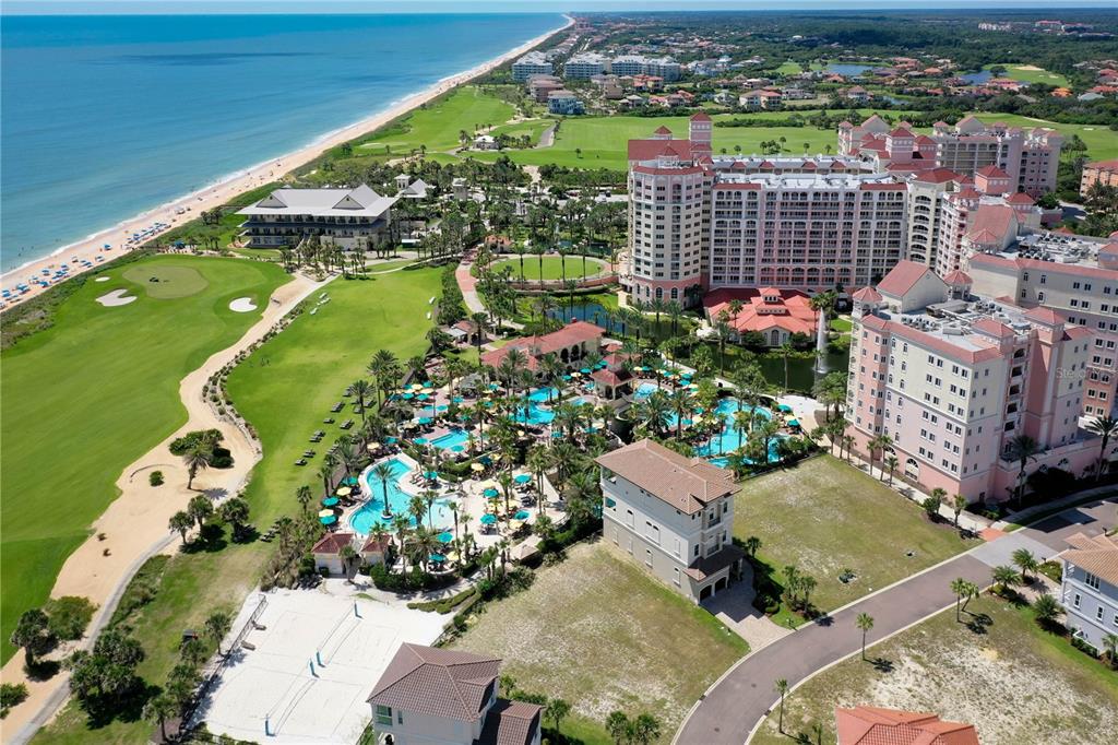 Aerial view of a large coastal resort with swimming pools, golf course, and beach access — 200 OCEAN CREST DRIVE UNIT 617, PALM COAST, FL