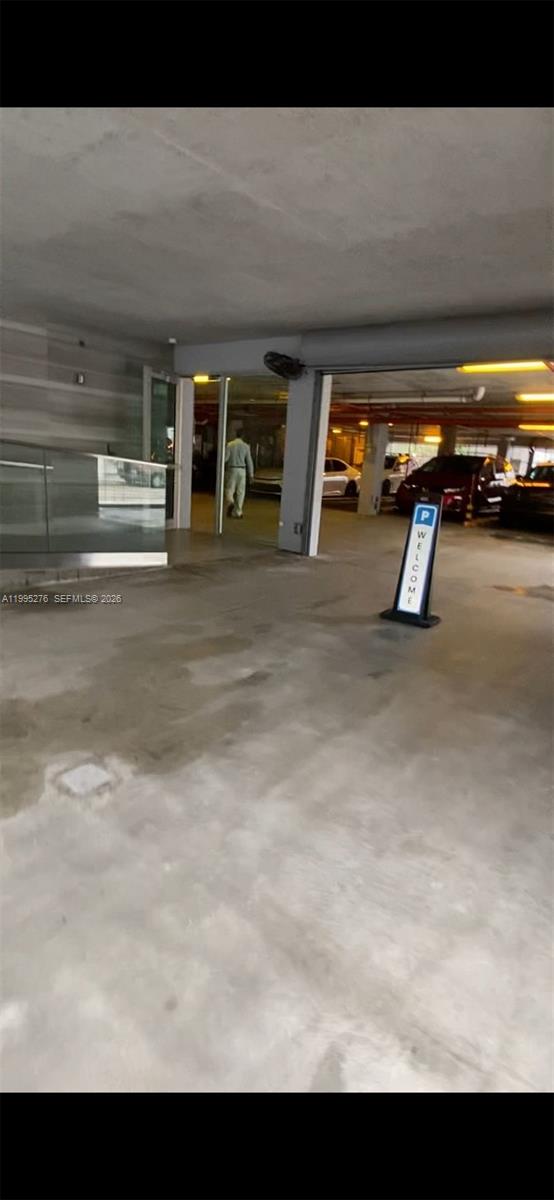This is a view of a concrete parking garage entrance with a welcome sign — 1215 W Ave Parking, Miami Beach FL 33139, MIAMI BEACH, FL