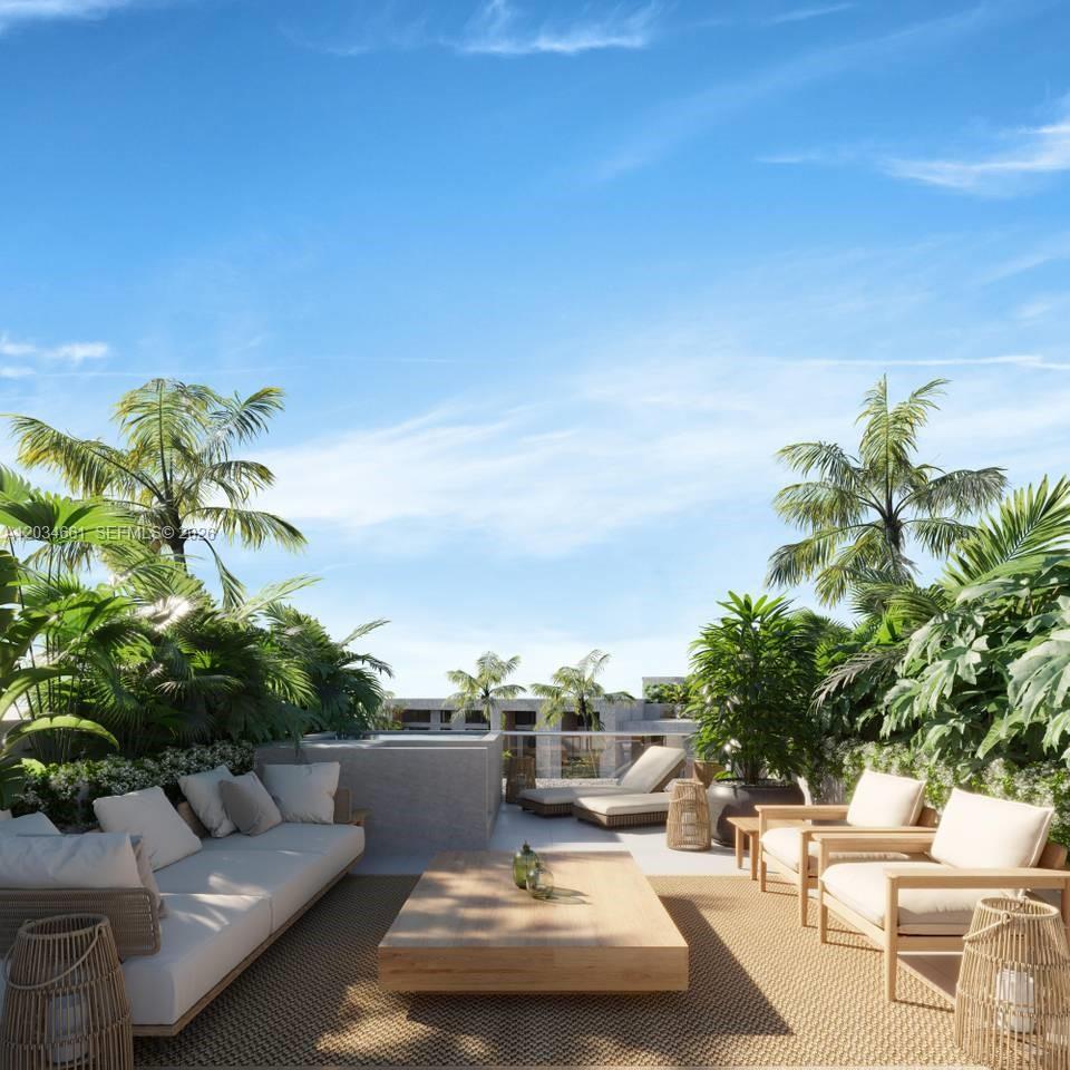 This rendering shows a rooftop terrace with outdoor seating, lush tropical plants, and lounge chairs — JJR6+692 punta cana # 1, FL