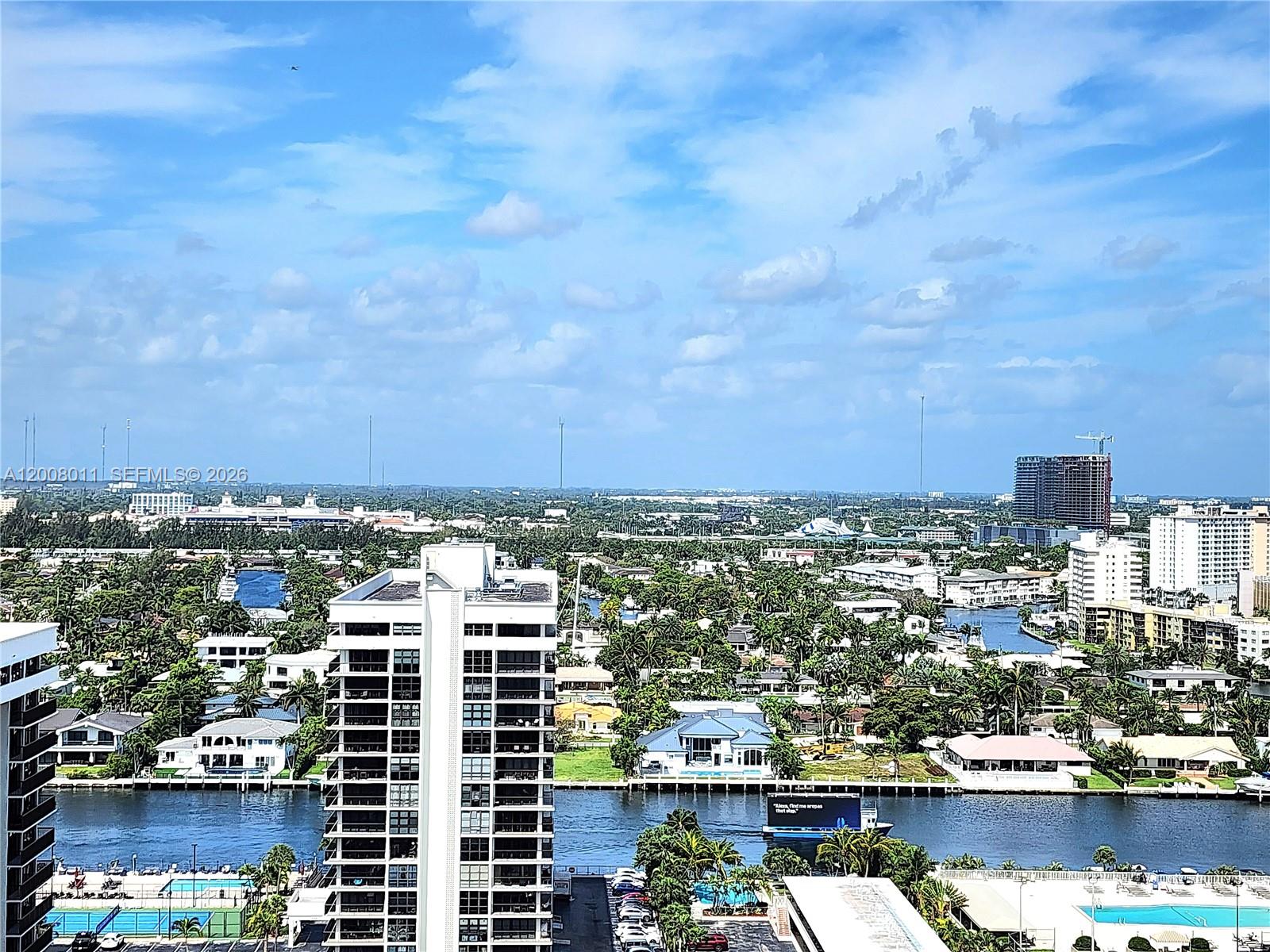 An elevated view shows a canal winding through a residential area with high-rise buildings — 2030 S Ocean Dr # 2026, Hallandale Beach FL 33009, HALLANDALE BEACH, FL