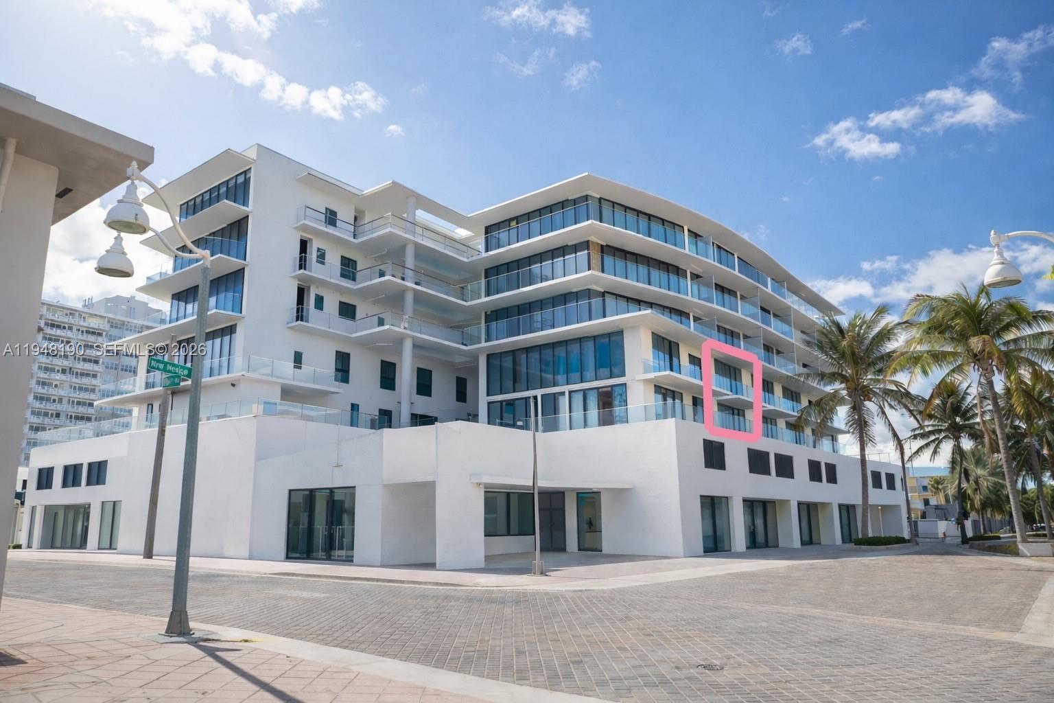 A modern white multi-story residential building with glass balconies and palm trees — 3319 N Ocean drive, Hollywood FL 33019, HOLLYWOOD, FL