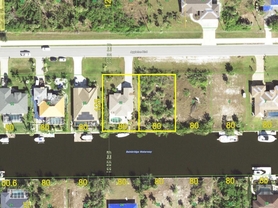 This is an aerial map showing two adjacent waterfront residential lots along a canal — 15009 APPLETON BOULEVARD, PORT CHARLOTTE, FL