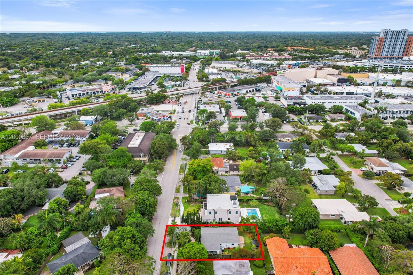 An aerial view shows a single-story house with a fenced yard outlined in red — 7840 SW 67th Ave, South Miami FL 33143, SOUTH MIAMI, FL