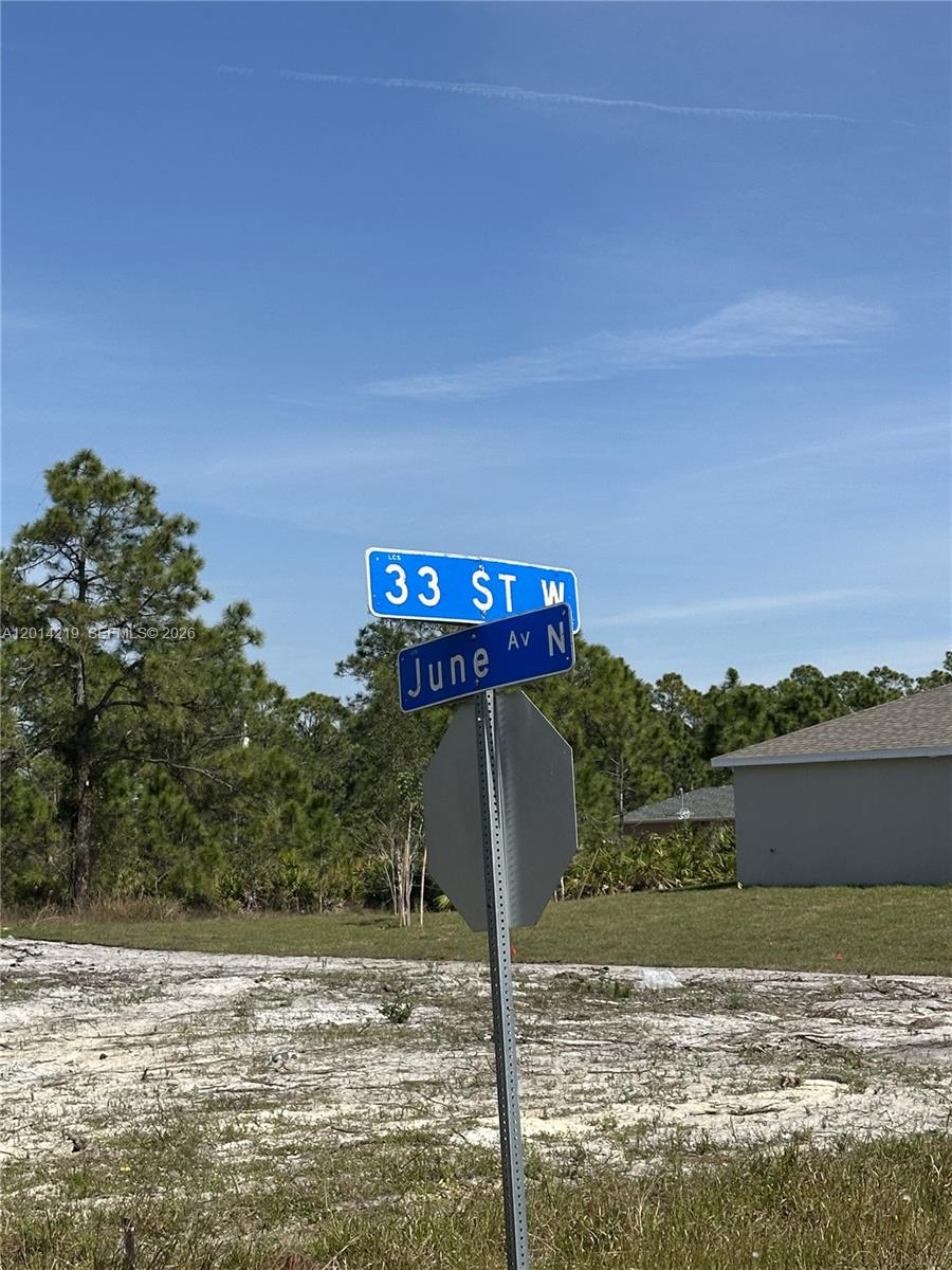 A street sign marks the intersection of 33 St W and June Av N — 2900 33rd St W, Lehigh Acres FL 33971, LEHIGH ACRES, FL