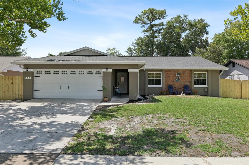 A kitchen coffee station features white cabinets, a wood countertop, and two pendant lights — 809 BIG BUCK CIRCLE, WINTER SPRINGS, FL
