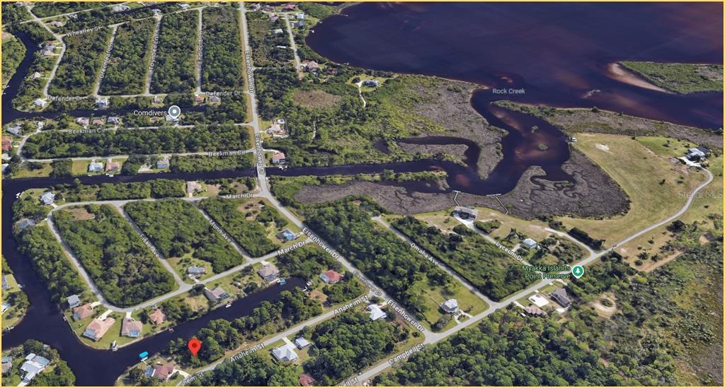 This is an aerial map view of a residential neighborhood near a waterway and preserve — 1144 ANAHEIM STREET, PORT CHARLOTTE, FL