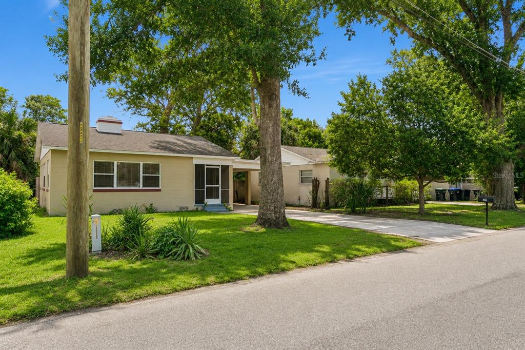 A single-story tan house with a carport and a large tree in the front yard — 846 DRIVER AVENUE, WINTER PARK, FL