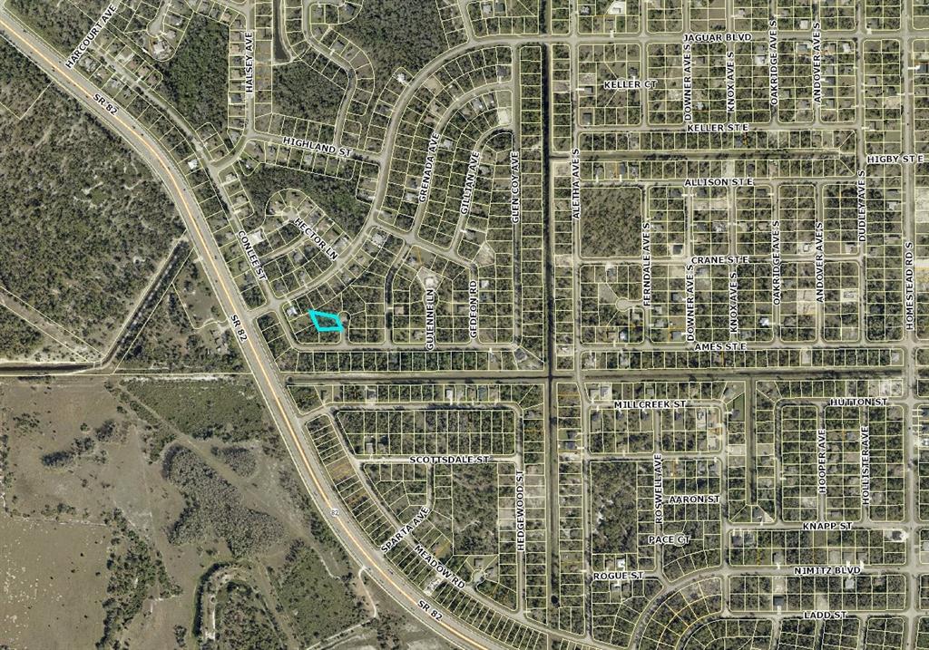 This is an aerial map showing a residential neighborhood with a highlighted property lot — 842 GRASSMERE CIRCLE, LEHIGH ACRES, FL