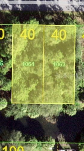 This aerial map shows two adjacent rectangular lots labeled 1064 and 1063 — 26145 FLOWER ROAD, PUNTA GORDA, FL