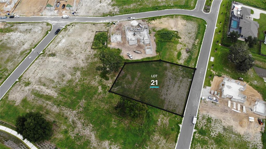 This aerial view shows a vacant residential lot marked as number 21 under construction — 523 WALKER STREET, OAKLAND, FL