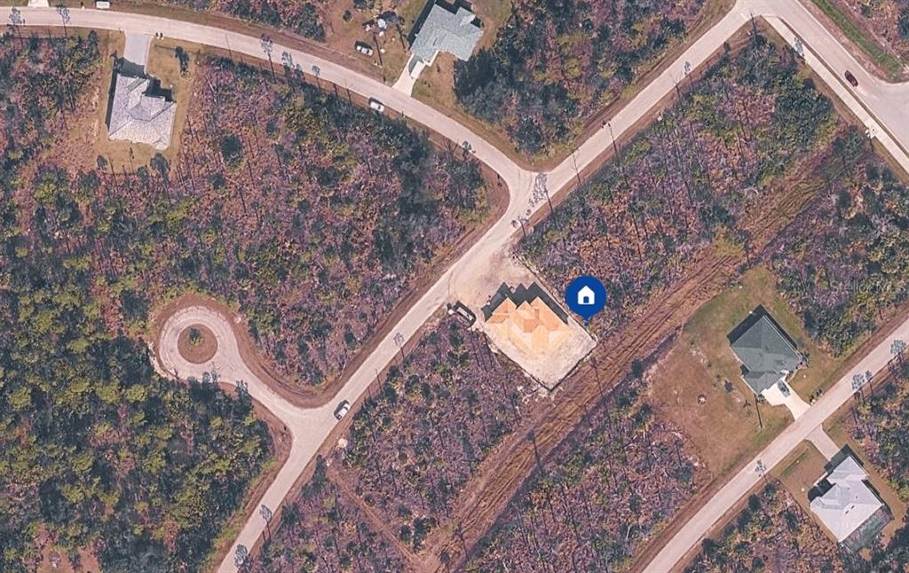 An aerial view shows a house under construction on a lot within a residential neighborhood — 8204 LEAFY WAY, PORT CHARLOTTE, FL
