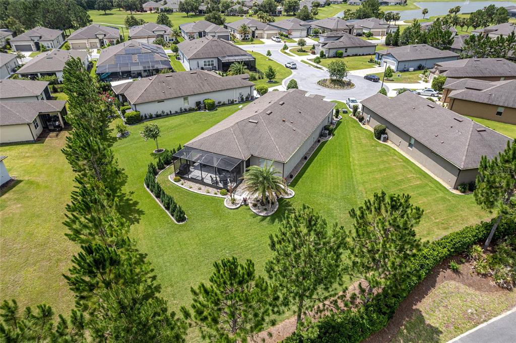 An aerial view shows a suburban house with a screened-in patio and a large lawn — 6259 SW 93RD TERRACE, OCALA, FL