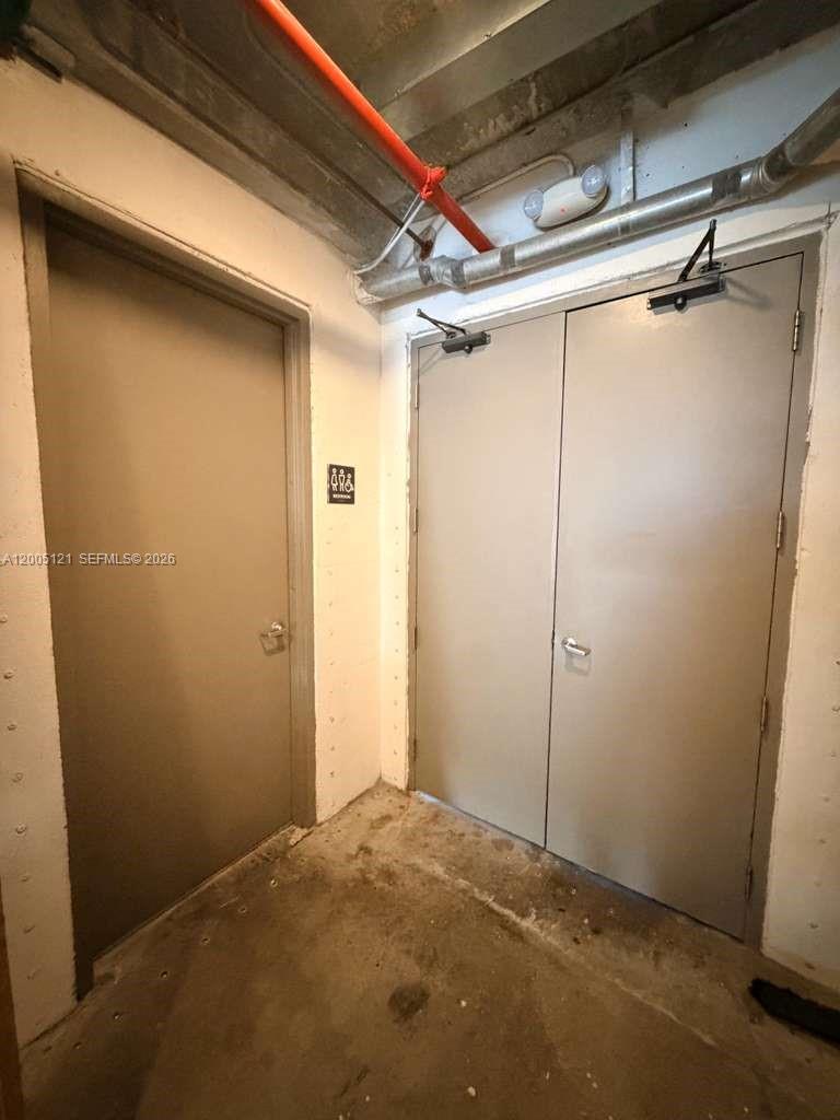 A utility area features a single door, double doors, and exposed overhead pipes — 538 Meridian Ave, Miami Beach FL 33139, MIAMI BEACH, FL