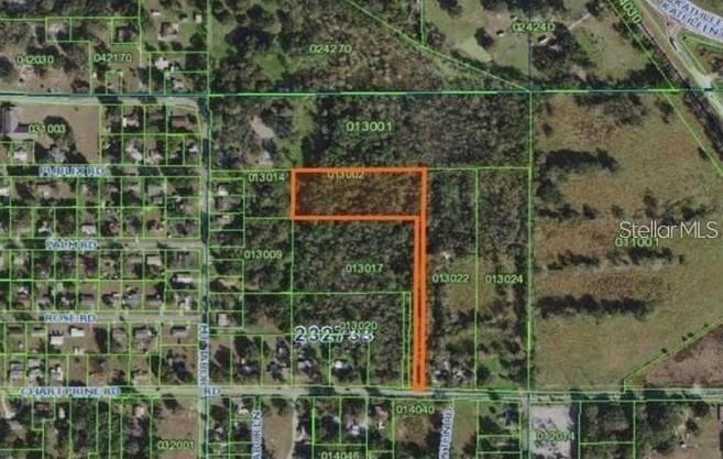 An aerial map shows a highlighted parcel of land with an L-shaped boundary — MT TABOR ROAD, LAKELAND, FL