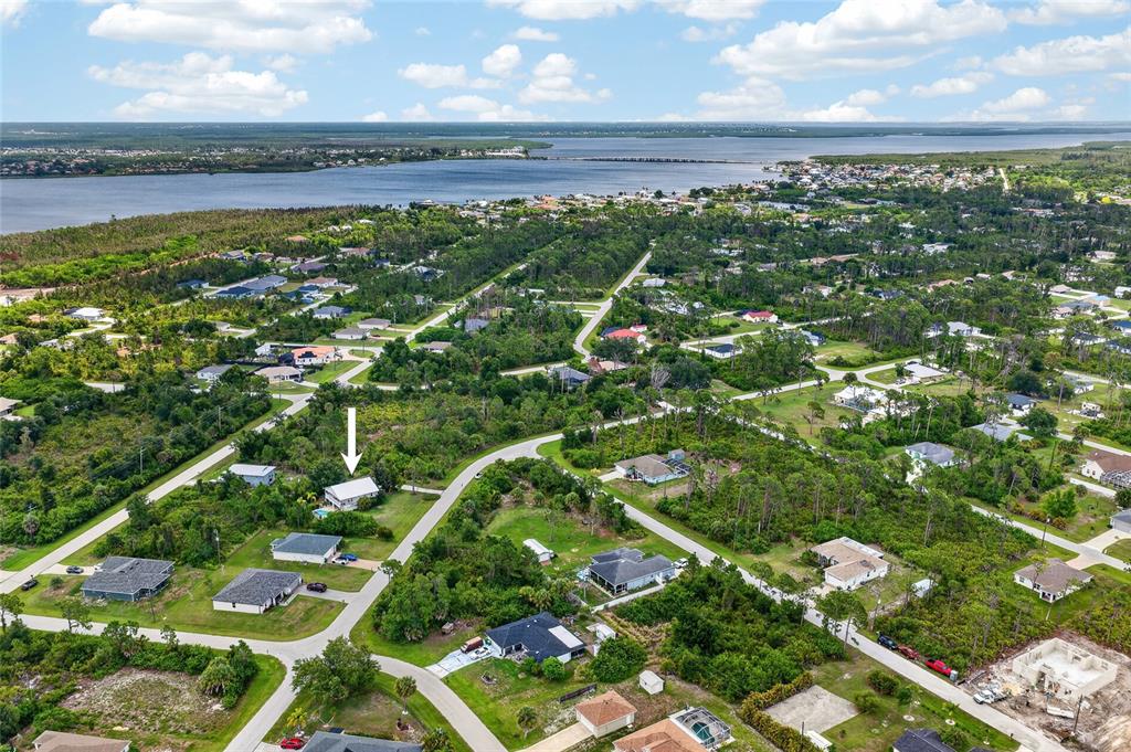 A two-story house with a balcony and a fenced-in swimming pool in the backyard — 5220 ANDERSON ROAD, PORT CHARLOTTE, FL