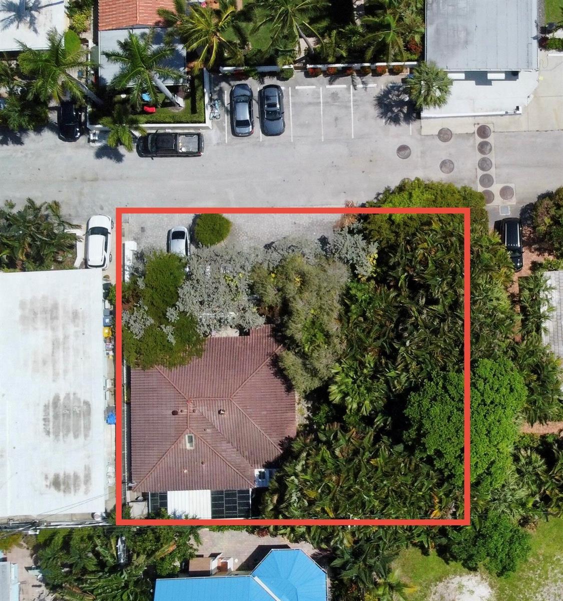 An aerial view shows a house with a tiled roof surrounded by dense trees and landscaping — 14 Tropical Drive, Ocean Ridge FL 33435, OCEAN RIDGE, FL