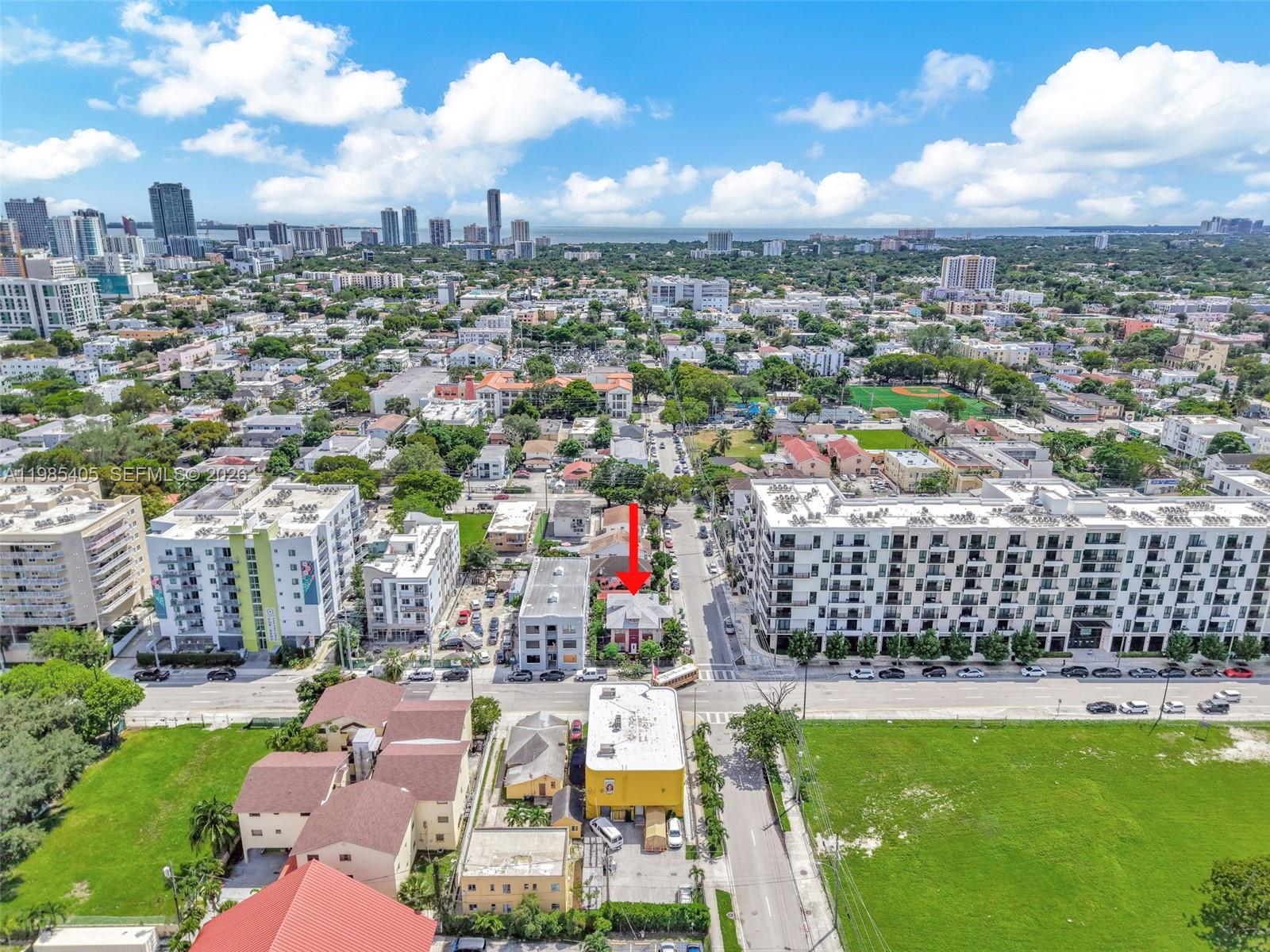 An aerial view shows a small house with a red arrow pointing to it — 676 & 119 SW 1st St, Miami FL 33130, MIAMI, FL