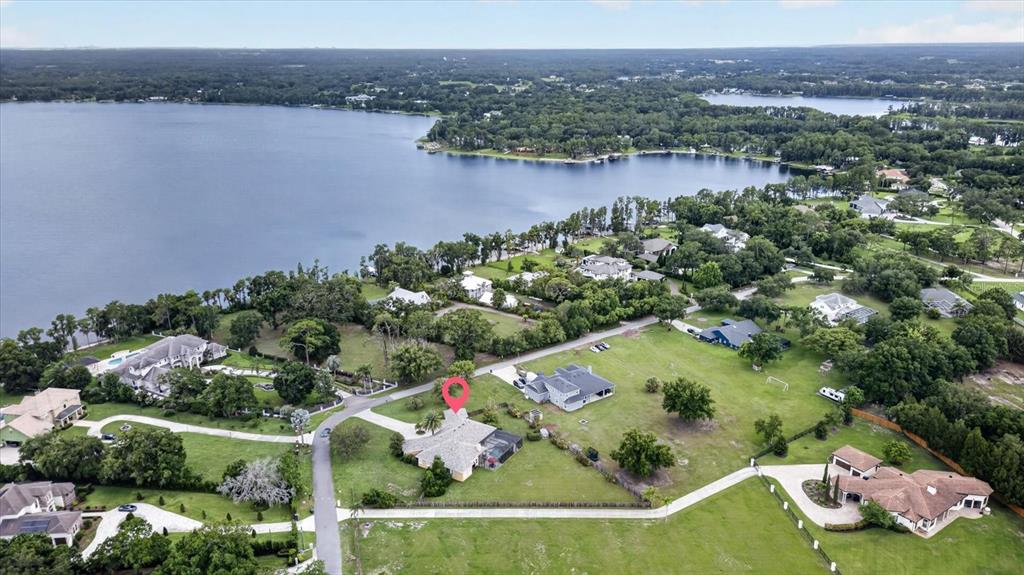 An aerial view shows a residential property with a red pin on a large lot — 9427 EDDINGS ROAD, ODESSA, FL