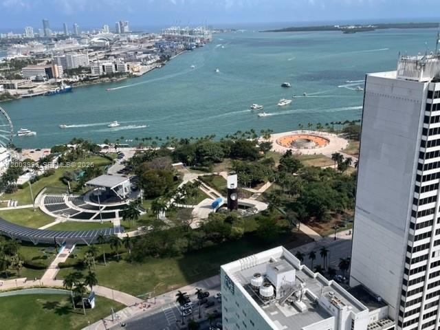 An aerial view shows a park with an amphitheater, a waterfront, and city buildings — 253 2nd St # 3807, Miami FL 33132, MIAMI, FL