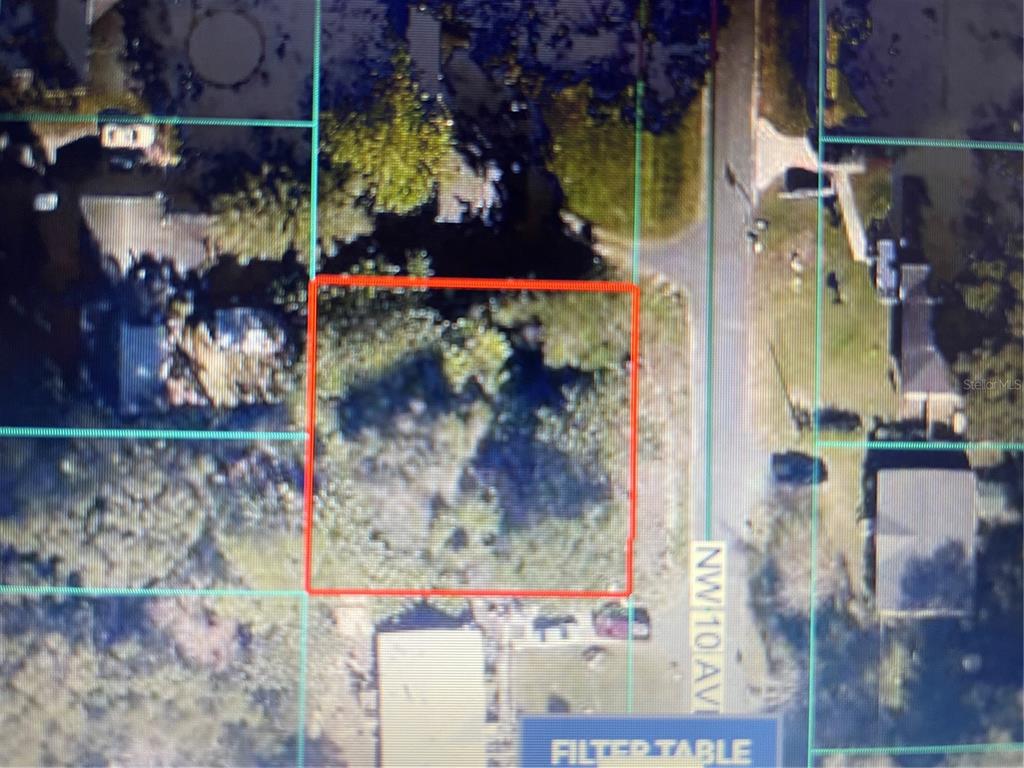 This is an aerial map view of a vacant, tree-covered residential lot — 00 NW 10TH AVENUE, OCALA, FL