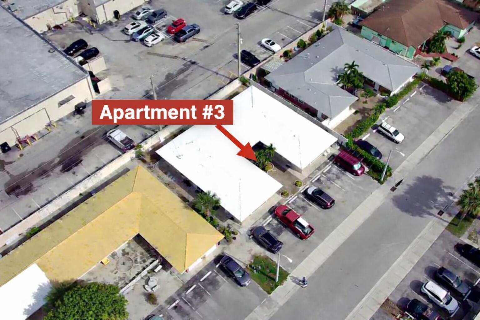 An aerial view shows a single-story apartment building with a white roof and parking lot — 1017 SE 3rd Street # 3, Deerfield Beach FL 33441, DEERFIELD BEACH, FL