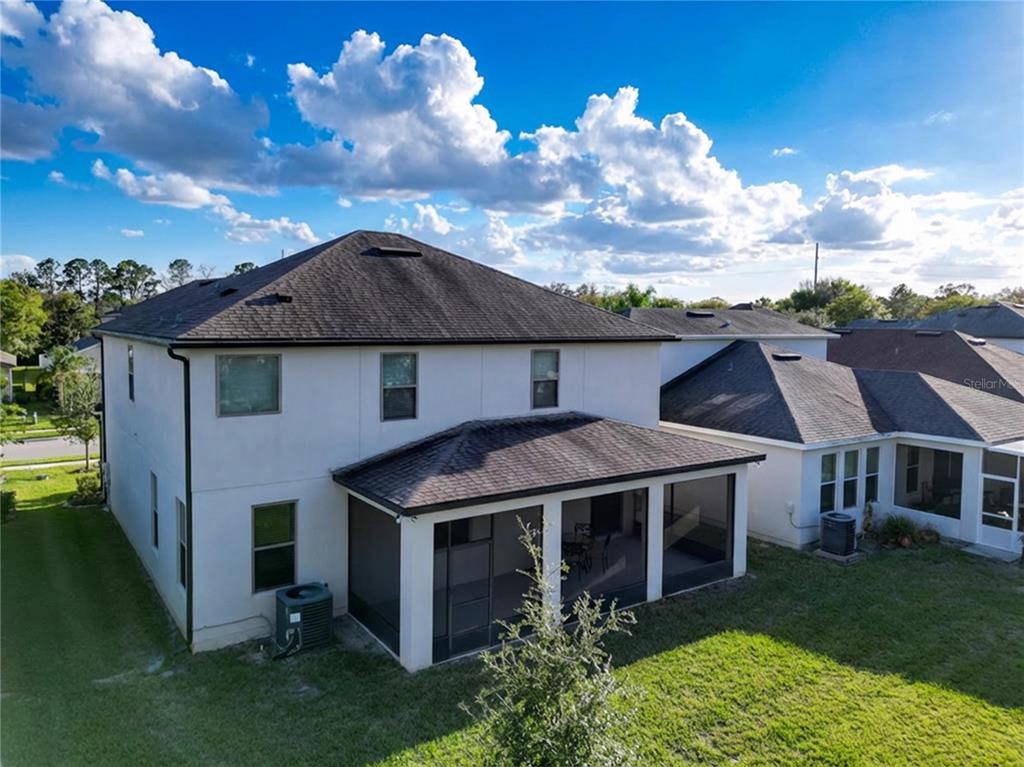 An aerial view of the back of a two-story house with a screened-in patio — 4892 ECHO COURT UNIT 44, OVIEDO, FL