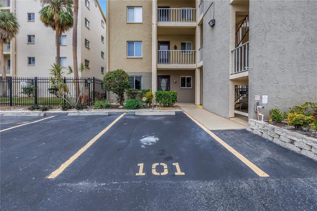 A parking space numbered 101 is located in front of a multi-story apartment building — 3500 LAKE BAYSHORE DRIVE UNIT K101, BRADENTON, FL
