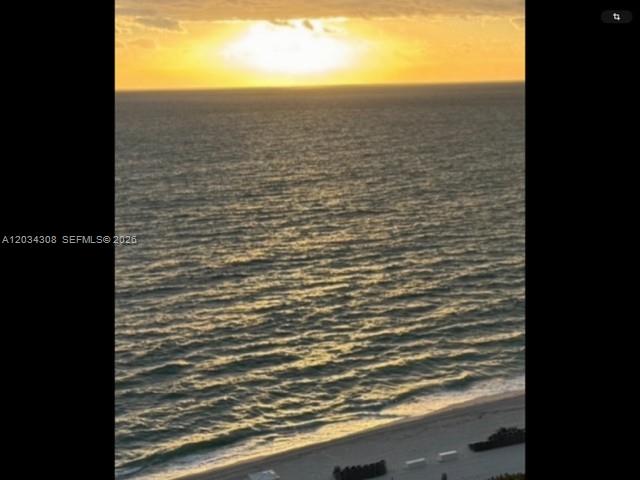 An elevated view of a sandy beach and ocean at sunset — 4779 Collins Ave # 1804, Miami Beach FL 33140, MIAMI BEACH, FL