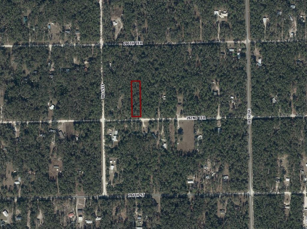 An aerial view shows a rectangular property lot outlined in red within a wooded area — 282ND TERRACE, BRANFORD, FL