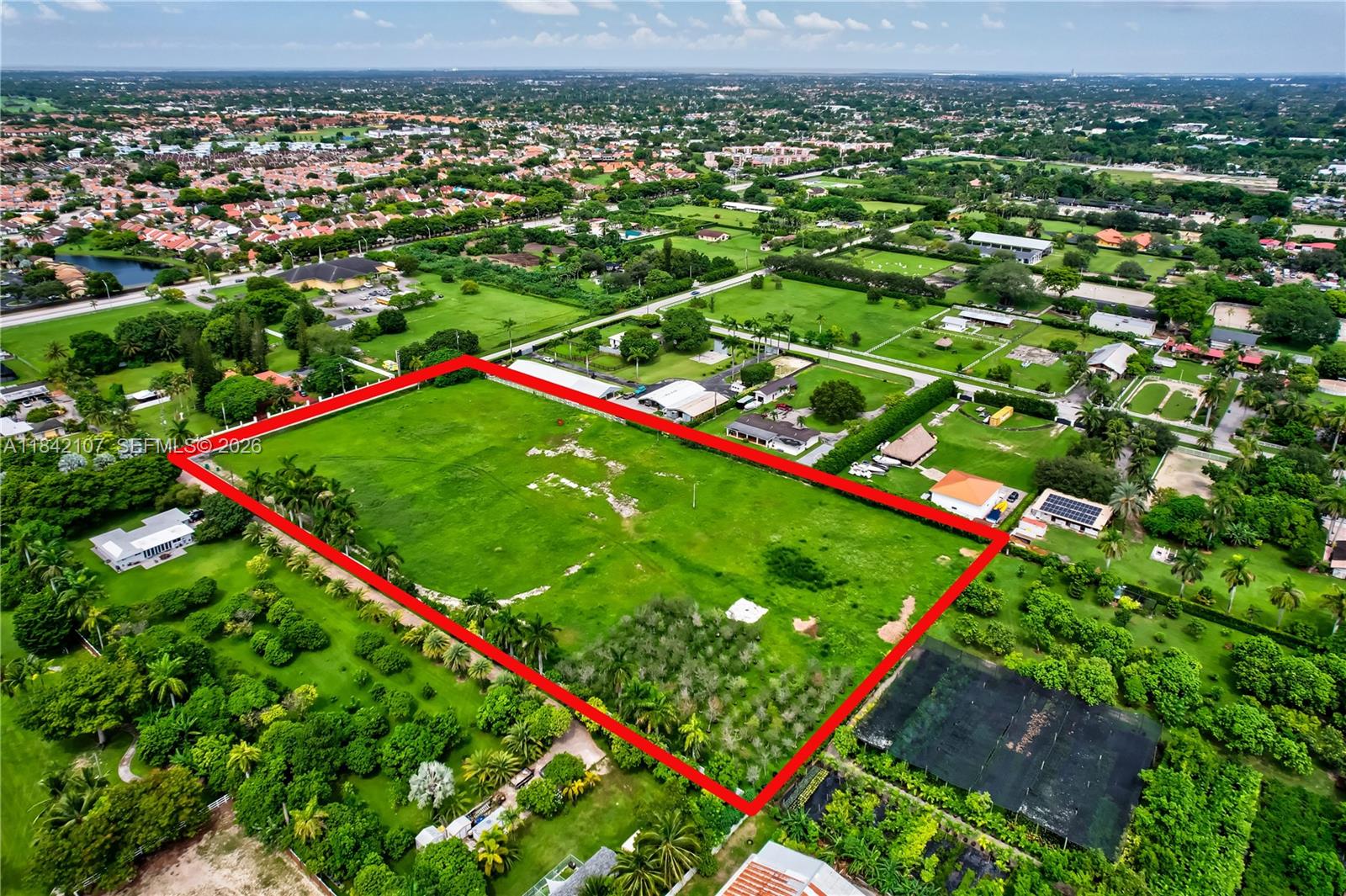 An aerial view shows a large, rectangular plot of vacant land outlined in red — 6501 SW 125th Ave, Miami FL 33183, MIAMI, FL
