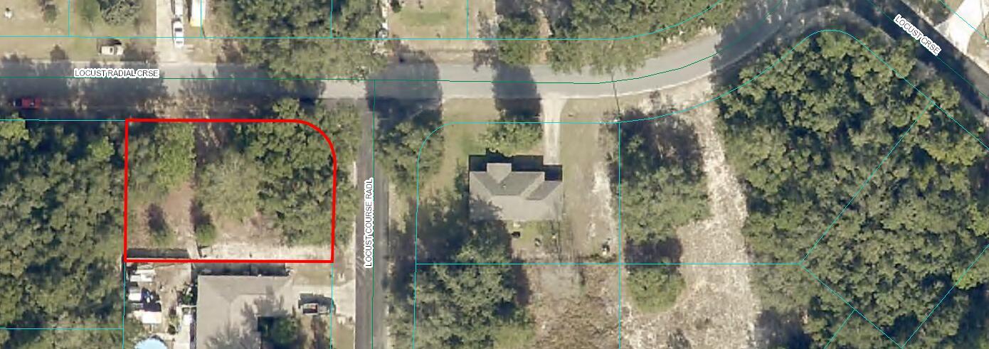 This is an aerial map view of a vacant, wooded corner lot outlined in red — 000 Locust Radial, Ocala FL 34472, OCALA, FL