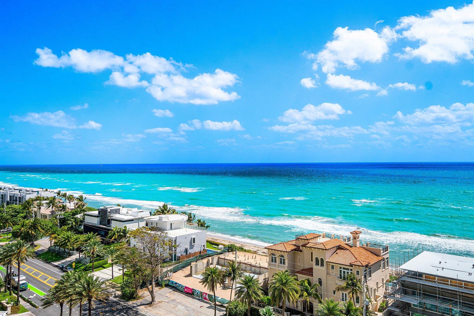 A covered balcony with light tile flooring overlooks the ocean and a white railing — 3740 S Ocean Boulevard # 1102, Highland Beach FL 33487, HIGHLAND BEACH, FL