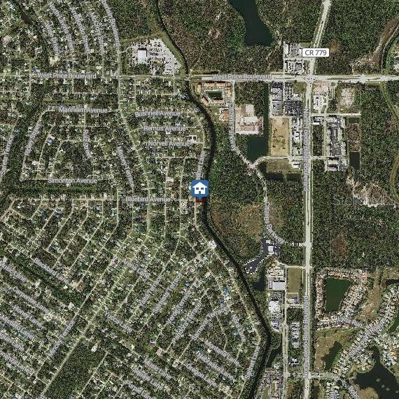 This is an aerial map showing a residential neighborhood with a highlighted property location — SADNET LANE, NORTH PORT, FL