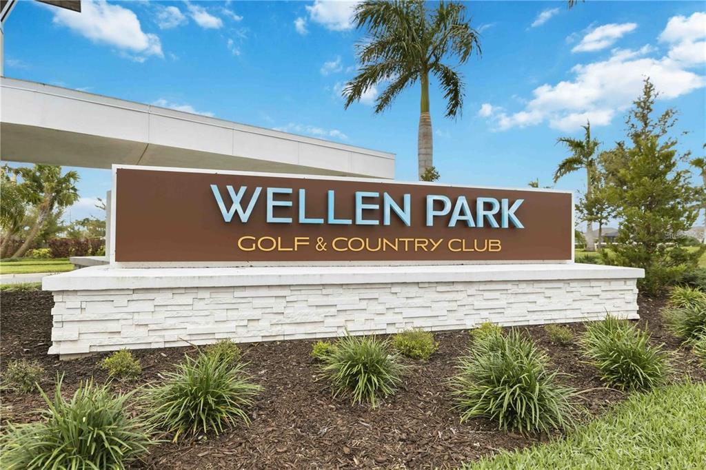 A brown and white monument sign for Wellen Park Golf & Country Club outdoors — 12240 WELLEN GOLF STREET UNIT 208, VENICE, FL