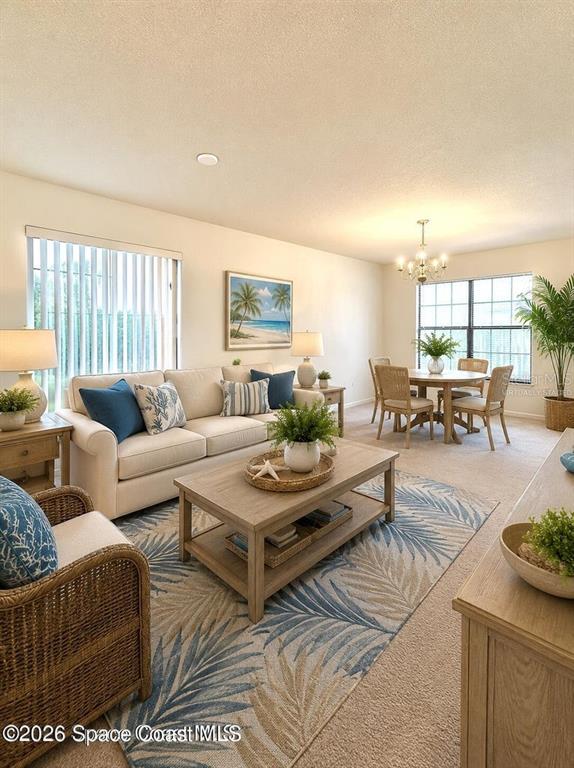 A living room features a beige sofa, a wooden coffee table, and a dining area — 782 MARIAN COURT, TITUSVILLE, FL